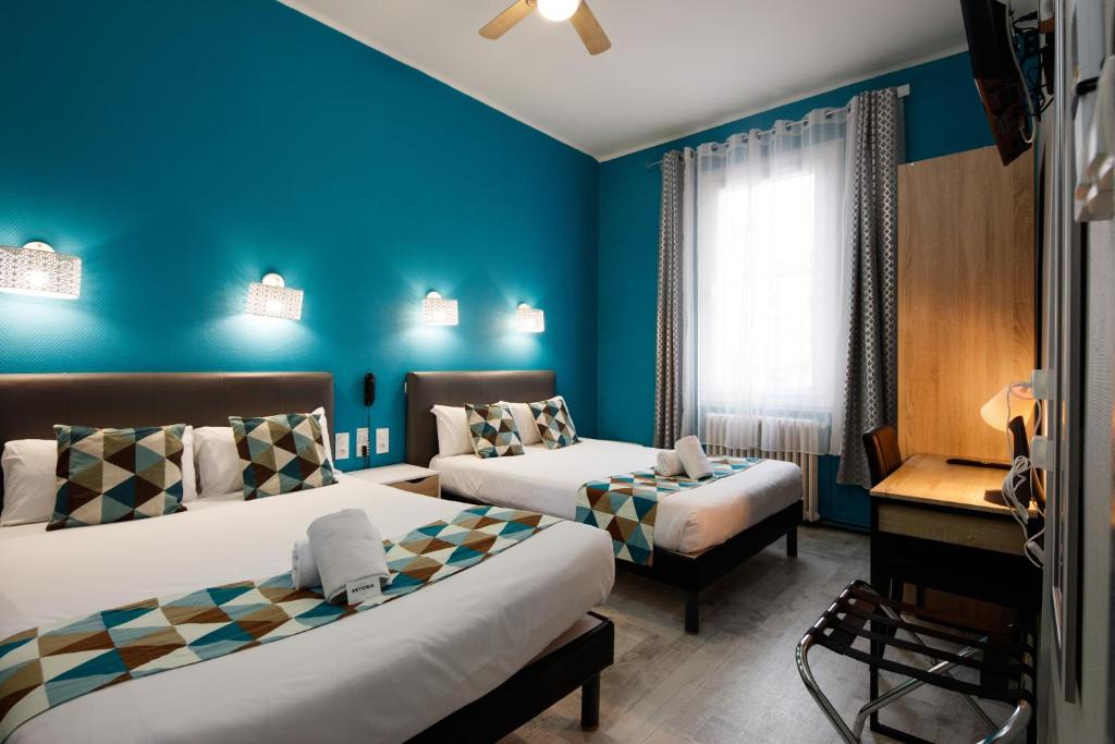 Postel nebo postele na pokoji v ubytování Hotel Astoria