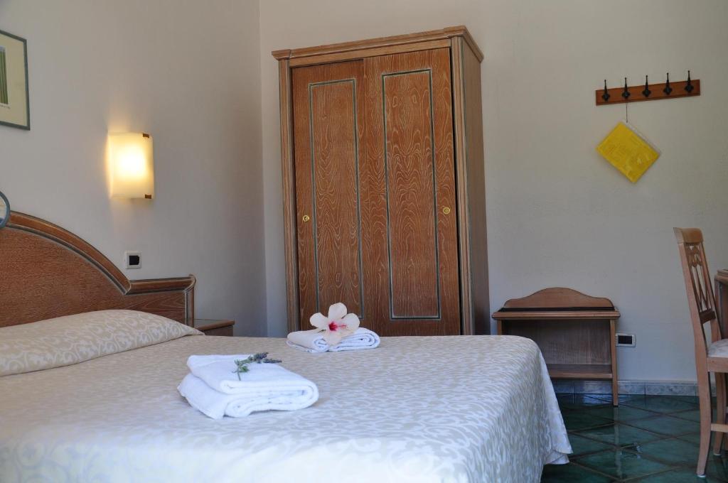 Postel nebo postele na pokoji v ubytování Hotel La Marticana