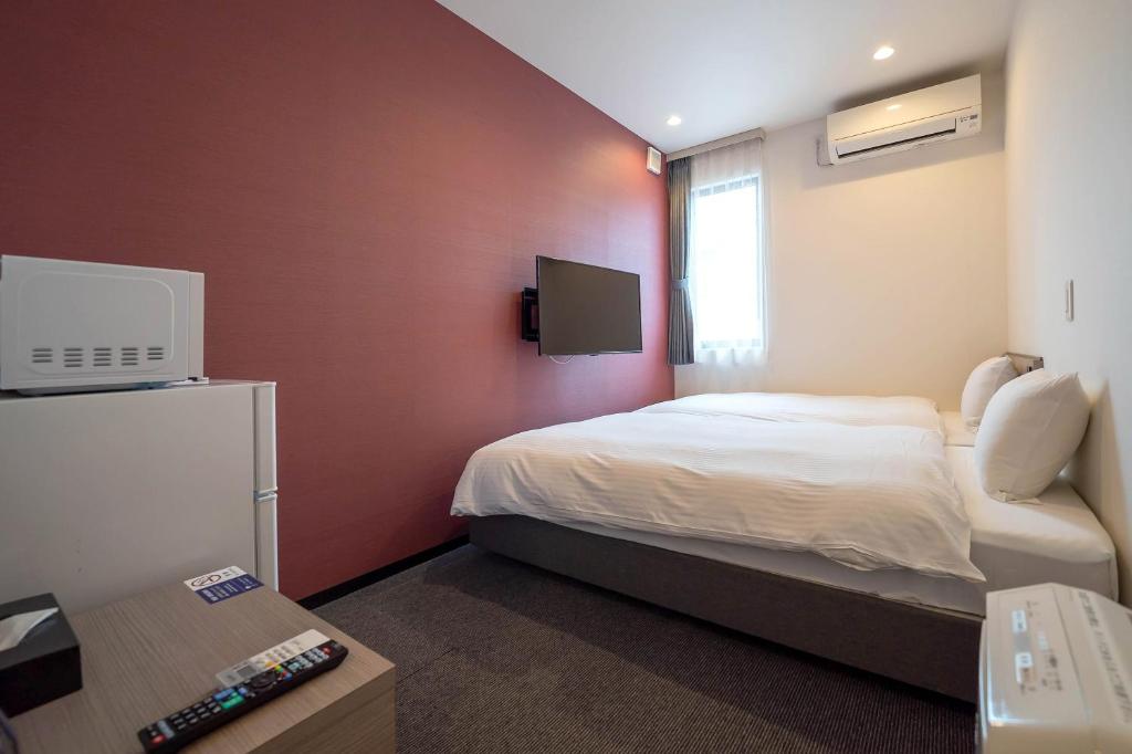 TV a/nebo společenská místnost v ubytování HOTEL R9 The Yard Taketoyo