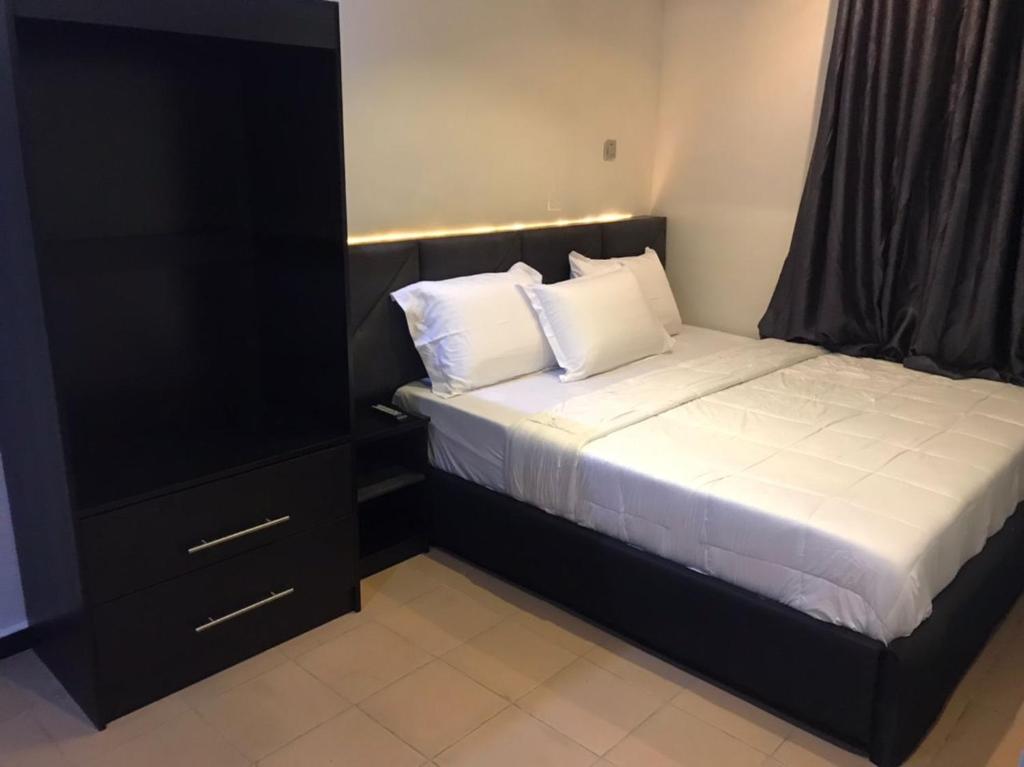 Cama o camas de una habitación en QARAS HOUSE 3 HOTELS