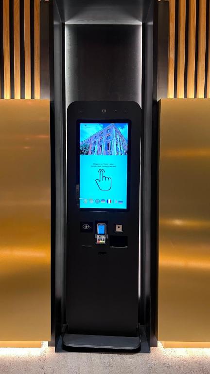 a cell phone in a black case with a tv on it at Hotel Centre Reus in Reus