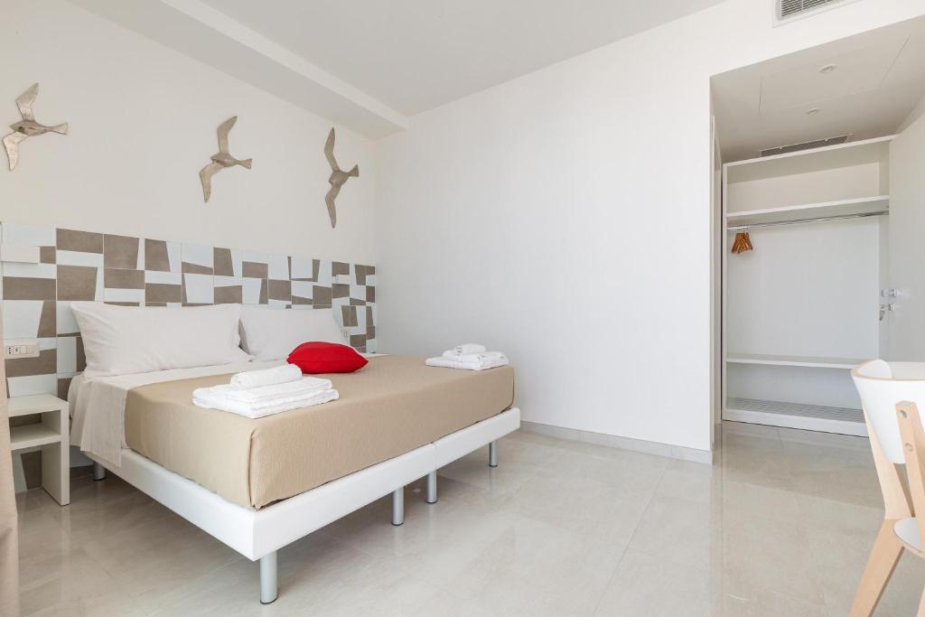 Postel nebo postele na pokoji v ubytování Stella del Mare Rooms