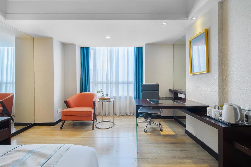TV a/nebo společenská místnost v ubytování Foshan Rezen Select Pasonda Hotel
