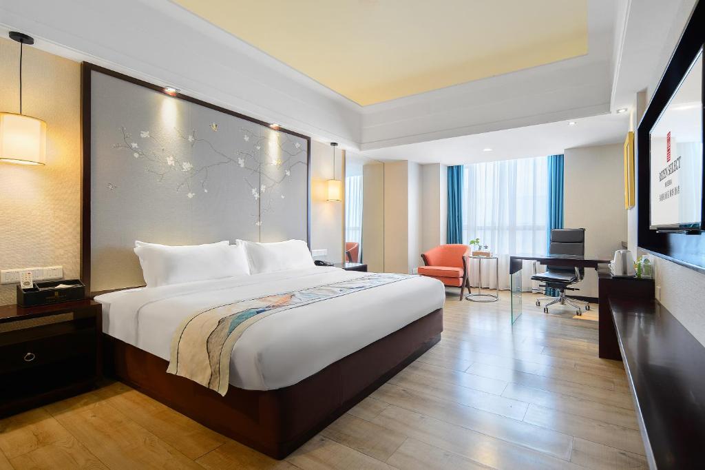 Postel nebo postele na pokoji v ubytování Foshan Rezen Select Pasonda Hotel