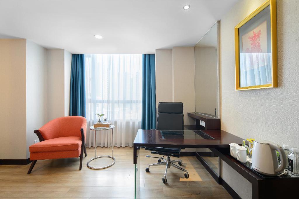 TV a/nebo společenská místnost v ubytování Foshan Rezen Select Pasonda Hotel