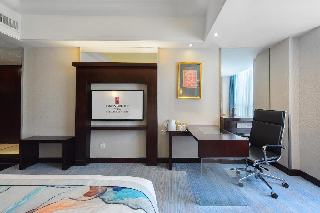 Postel nebo postele na pokoji v ubytování Foshan Rezen Select Pasonda Hotel