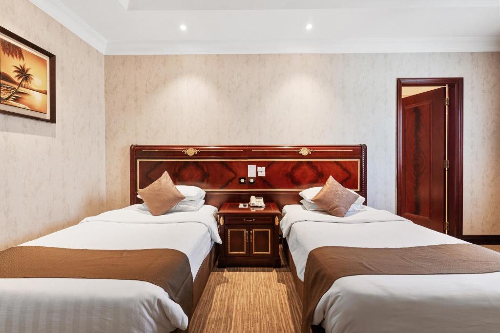 Krevet ili kreveti u jedinici u okviru objekta Chairmen Hotel