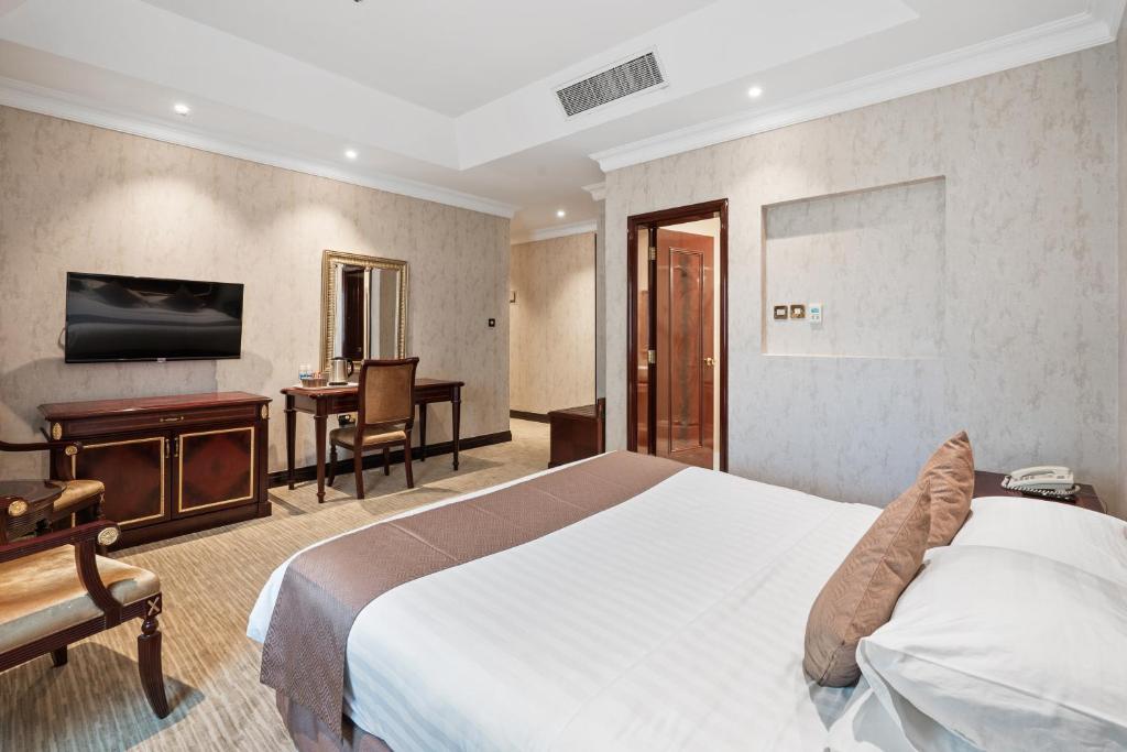 Krevet ili kreveti u jedinici u okviru objekta Chairmen Hotel
