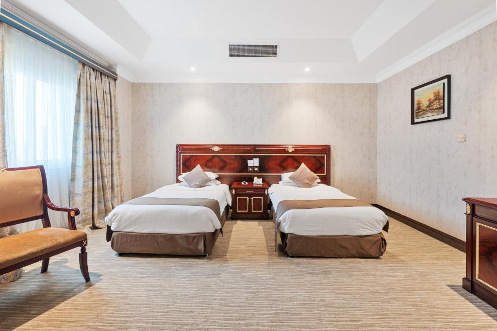 Krevet ili kreveti u jedinici u okviru objekta Chairmen Hotel