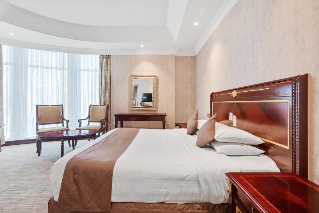 Krevet ili kreveti u jedinici u okviru objekta Chairmen Hotel