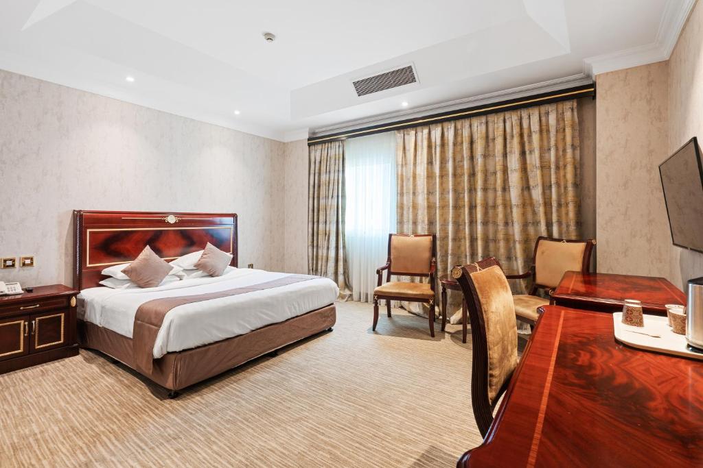 Krevet ili kreveti u jedinici u okviru objekta Chairmen Hotel