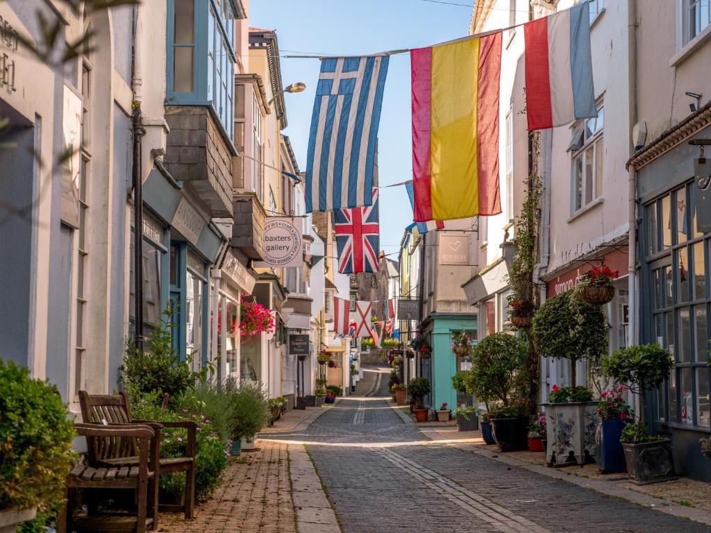 a street in ireland with flags hanging from buildings at Waterfront House in Dartmouth