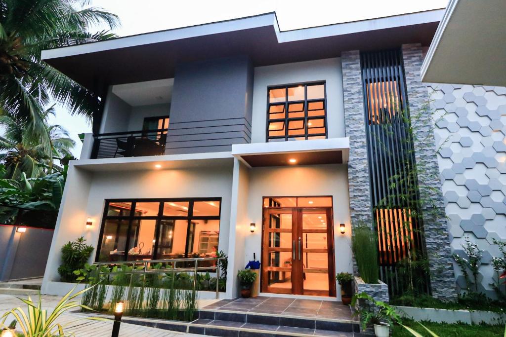 a house with a front door in front of it at Josefina's Tourist Inn in Busuanga