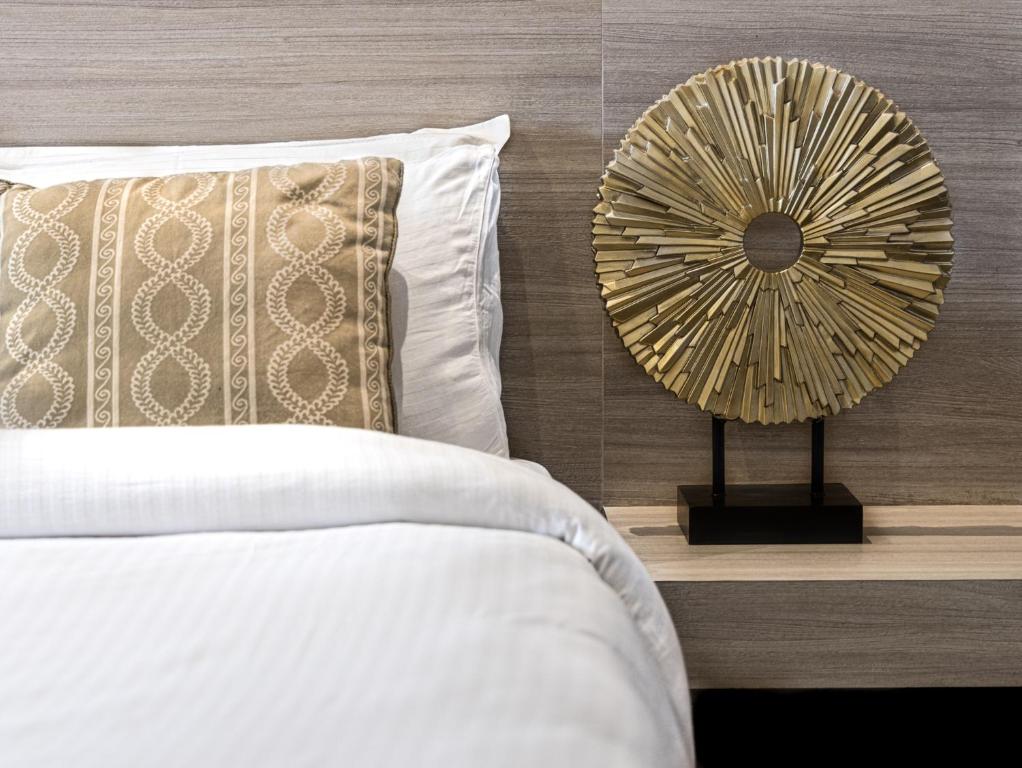 Postel nebo postele na pokoji v ubytování Vastu Boutique Hotel