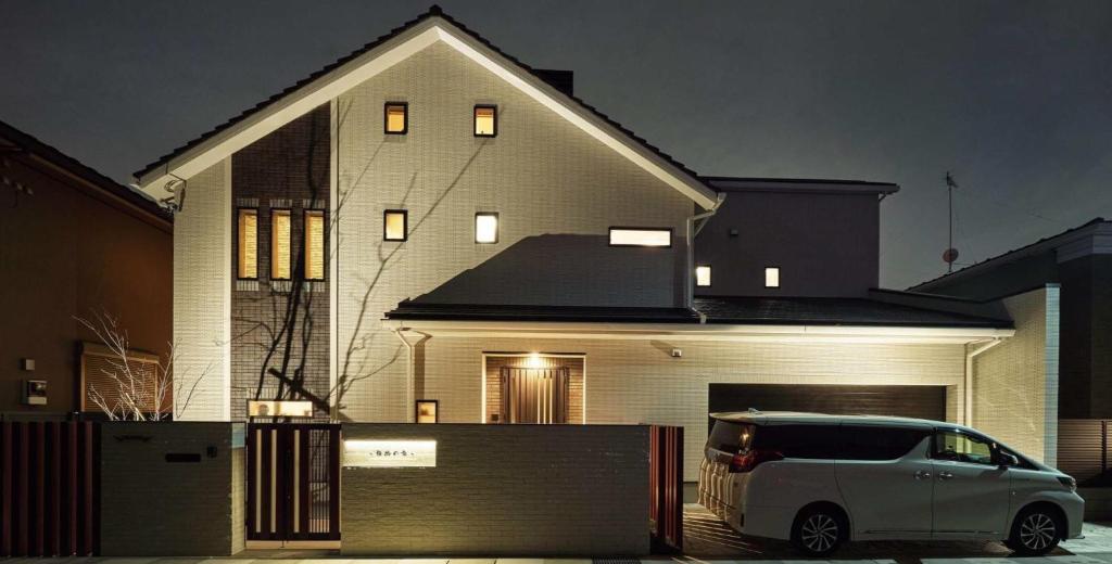 a white car parked in front of a house at Gasho No Ie - Vacation STAY 11379 in Koshigaya