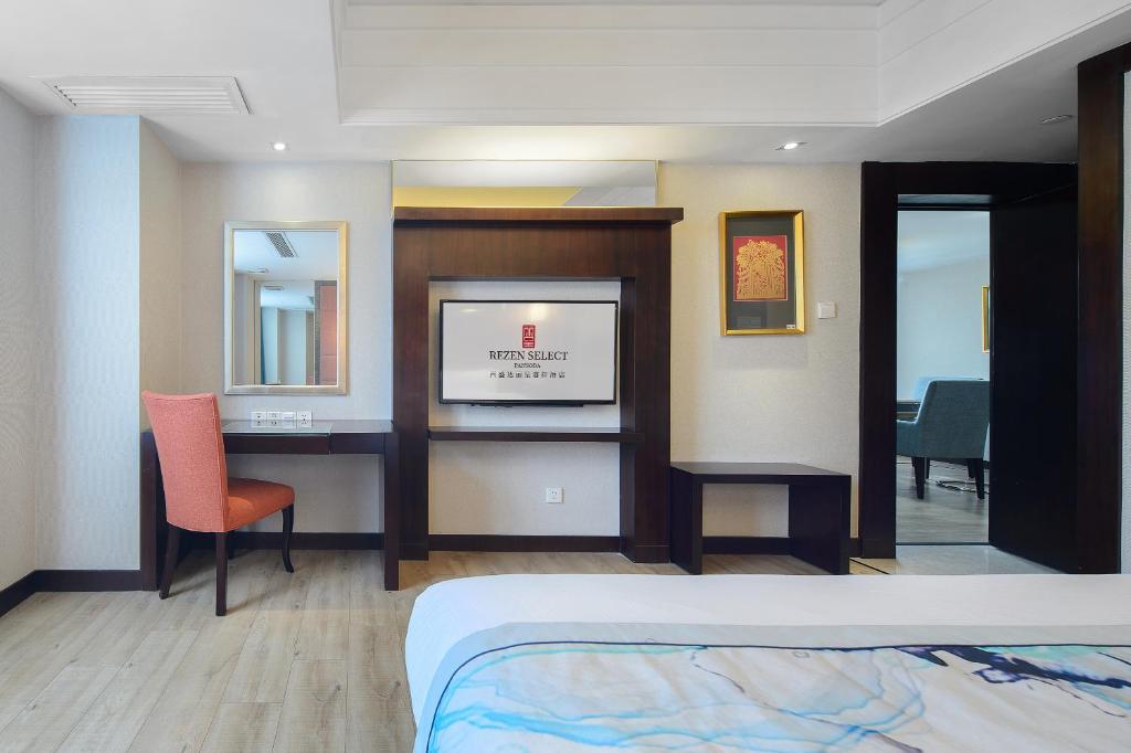 Postel nebo postele na pokoji v ubytování Foshan Rezen Select Pasonda Hotel