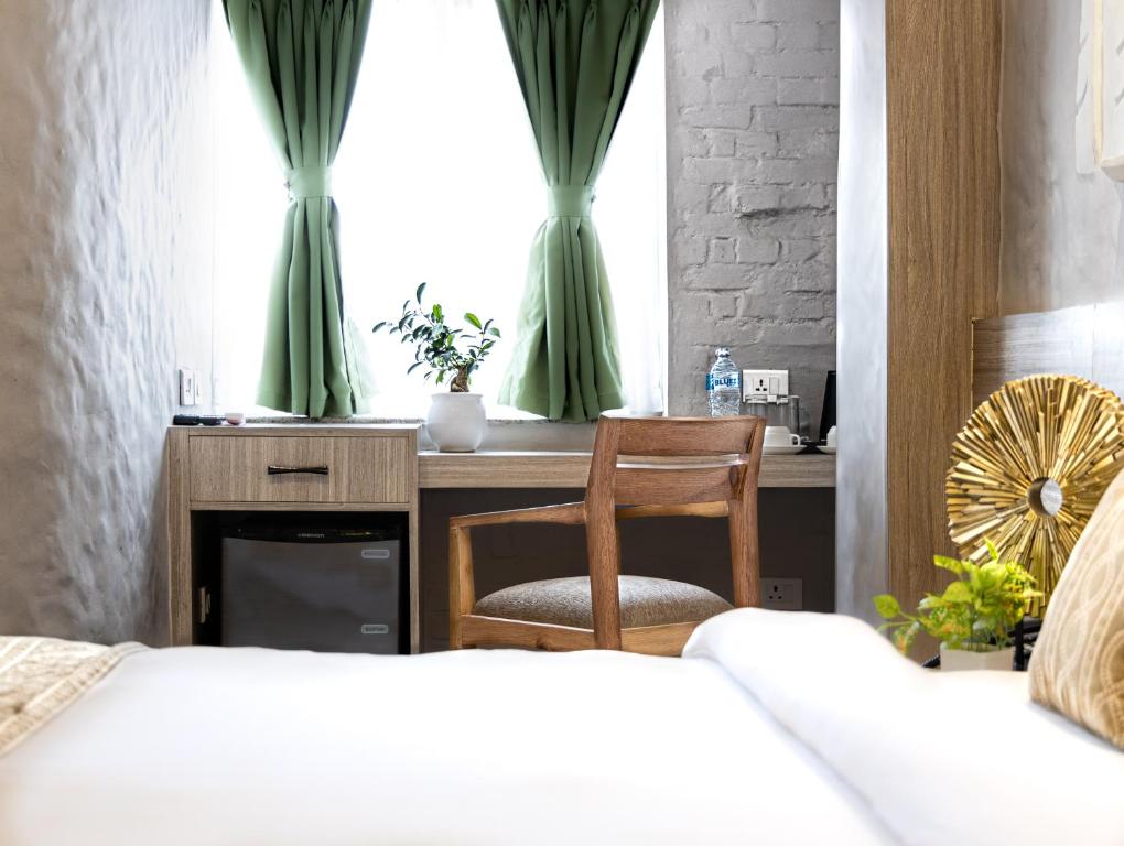 Postel nebo postele na pokoji v ubytování Vastu Boutique Hotel