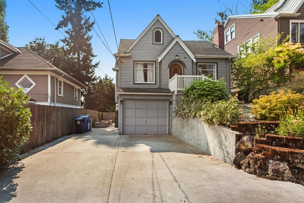 a house with a driveway and a garage at Hidden Gem in Green Lake in Seattle