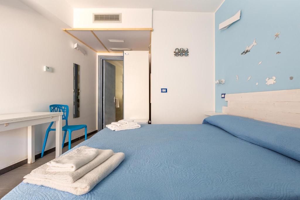 Postel nebo postele na pokoji v ubytování Maresidence Rooms & Breakfast