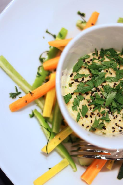 a bowl of dip with vegetables on a plate at L'Eautel Toulon Centre Port in Toulon