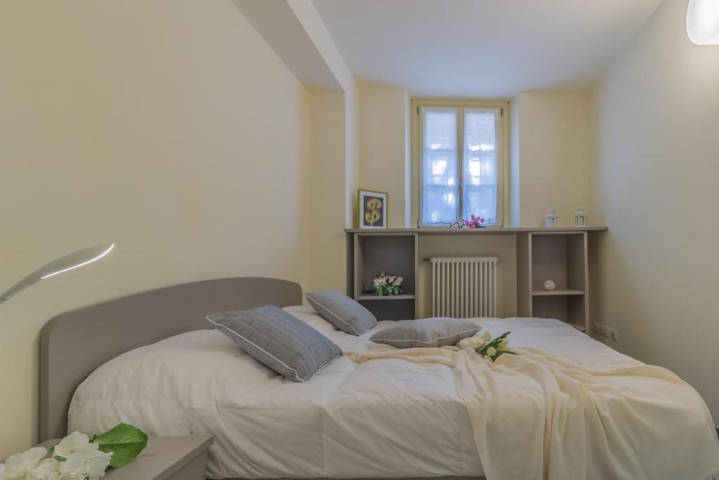 Łóżko lub łóżka w pokoju w obiekcie Tiny Duke Apartment