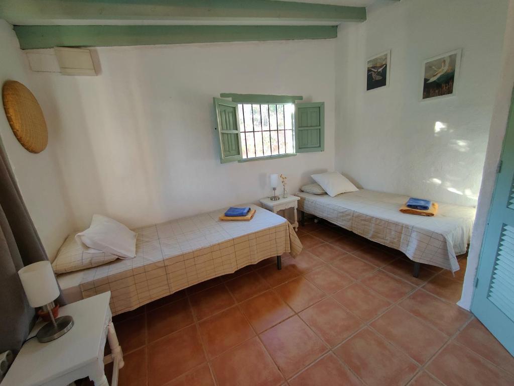 Posteľ alebo postele v izbe v ubytovaní Cortijo Vacas Gordas Villas