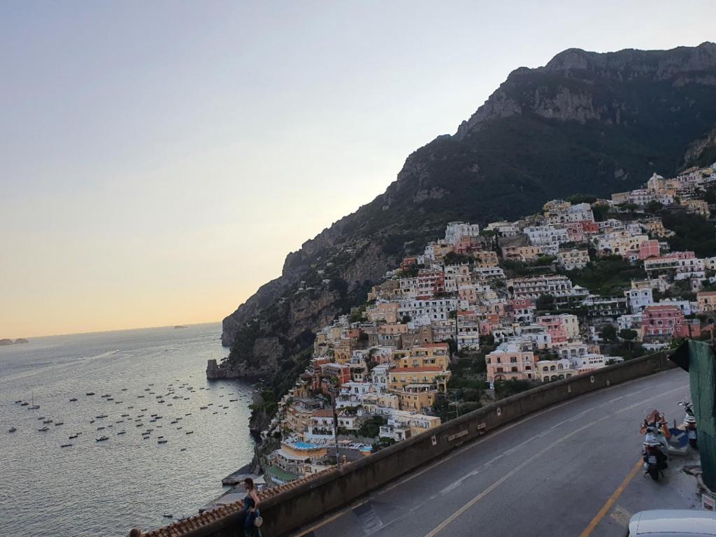 a view of a town on a hill next to the water at La Casa di Nunzia B&B in Positano