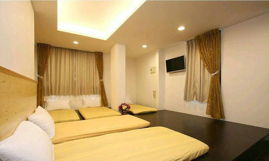 Posteľ alebo postele v izbe v ubytovaní Ziteng Hua Homestay