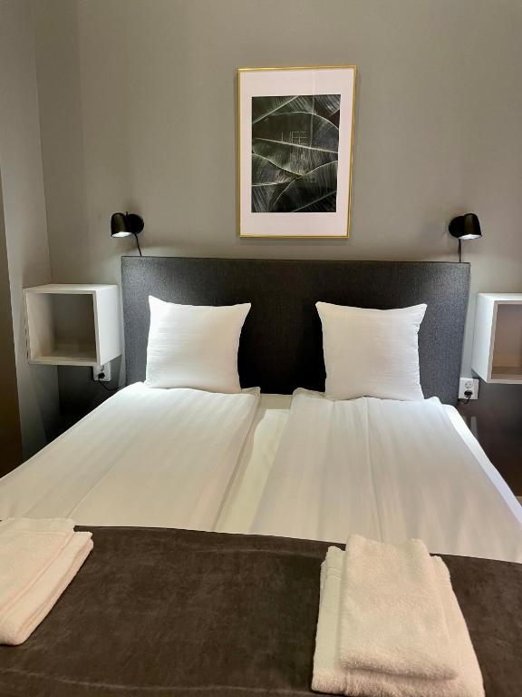 Postel nebo postele na pokoji v ubytování Unique Hotel