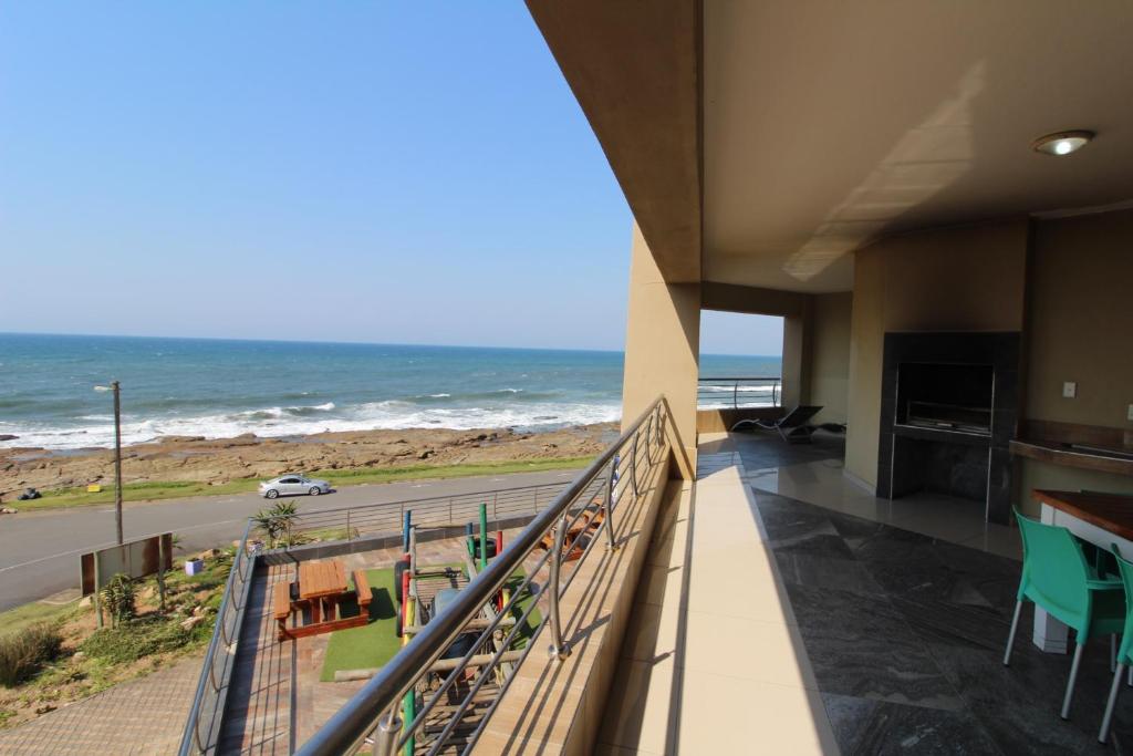 a balcony with a view of the ocean at Saints View Resort Unit 14 in Uvongo Beach