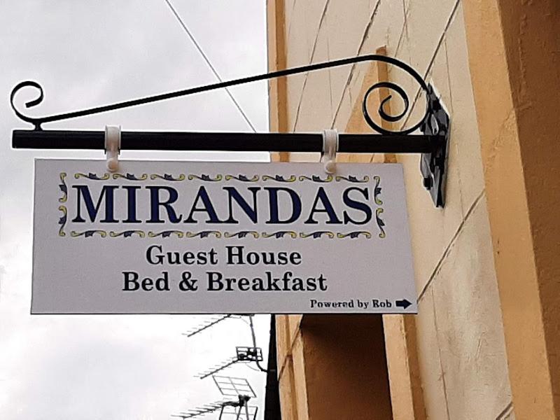 un cartello per un bed & breakfast di Mirandas Guest House a Berwick-Upon-Tweed