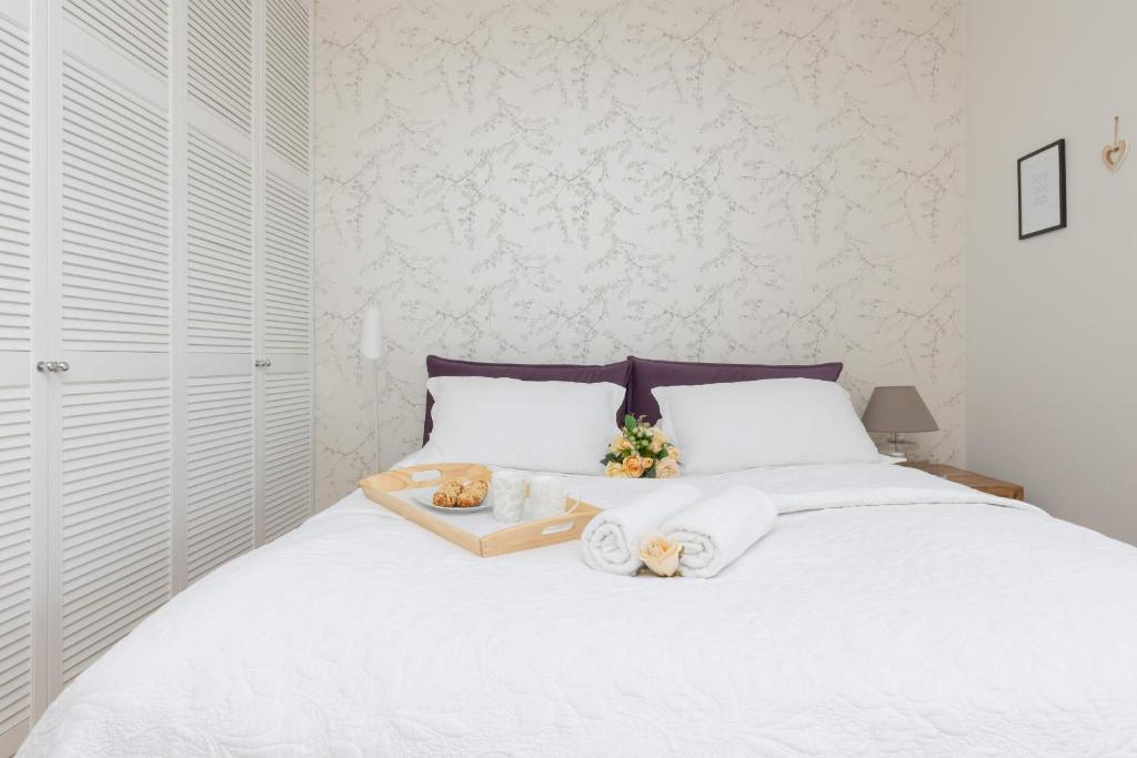 Posteľ alebo postele v izbe v ubytovaní Quiet Apartment Park Edwarda Szymańskiego by Noclegi Renters
