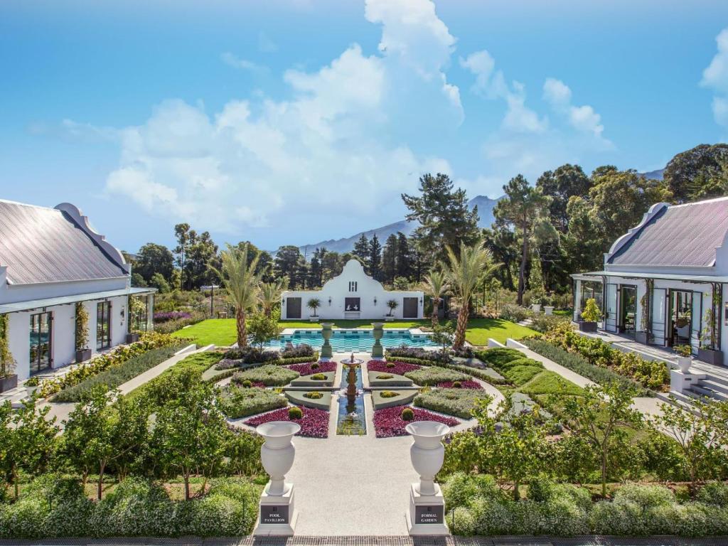 an aerial view of the gardens of a mansion at Monument House in Franschhoek