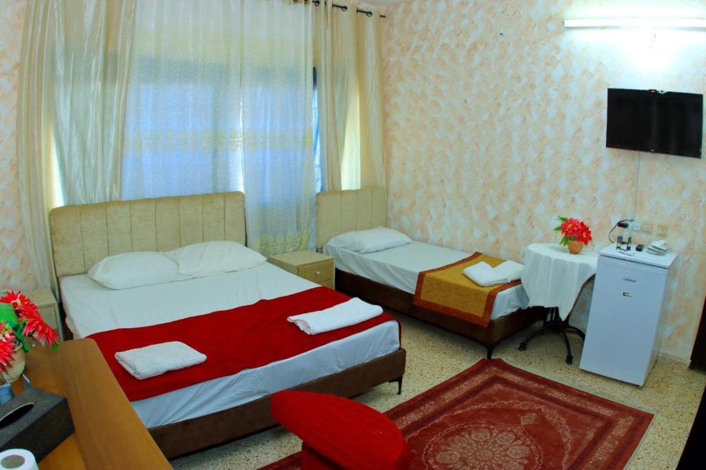 Postel nebo postele na pokoji v ubytování Magtas Hotel