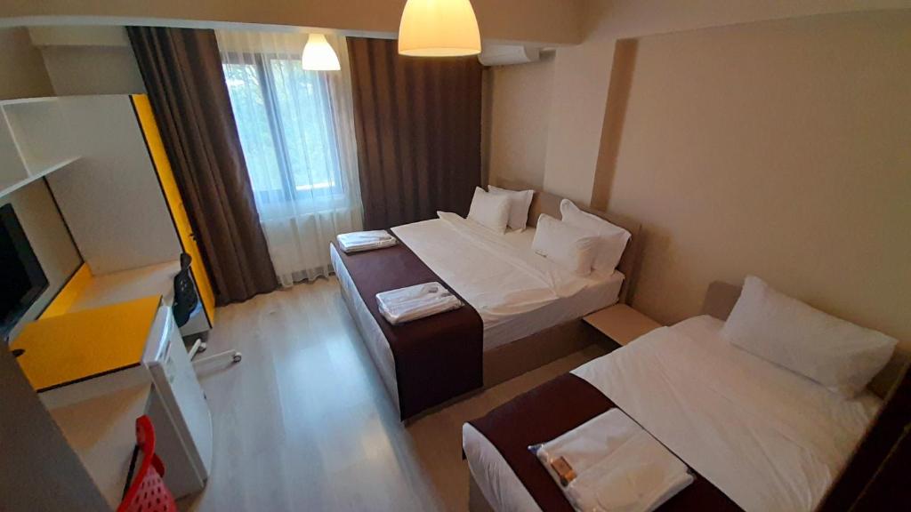 Postel nebo postele na pokoji v ubytování Moda Hotel