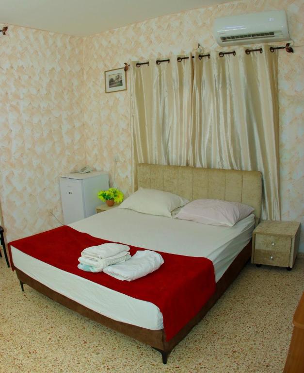Postel nebo postele na pokoji v ubytování Magtas Hotel