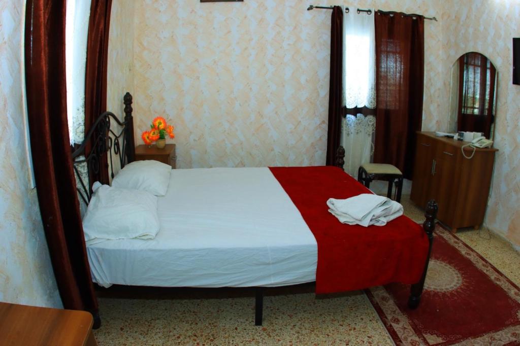 Postel nebo postele na pokoji v ubytování Magtas Hotel