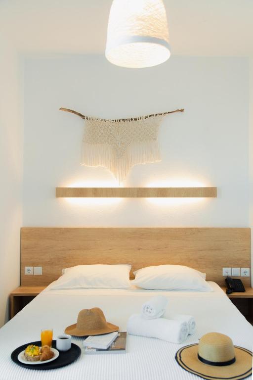 Voodi või voodid majutusasutuse Calma Beach Hotel toas