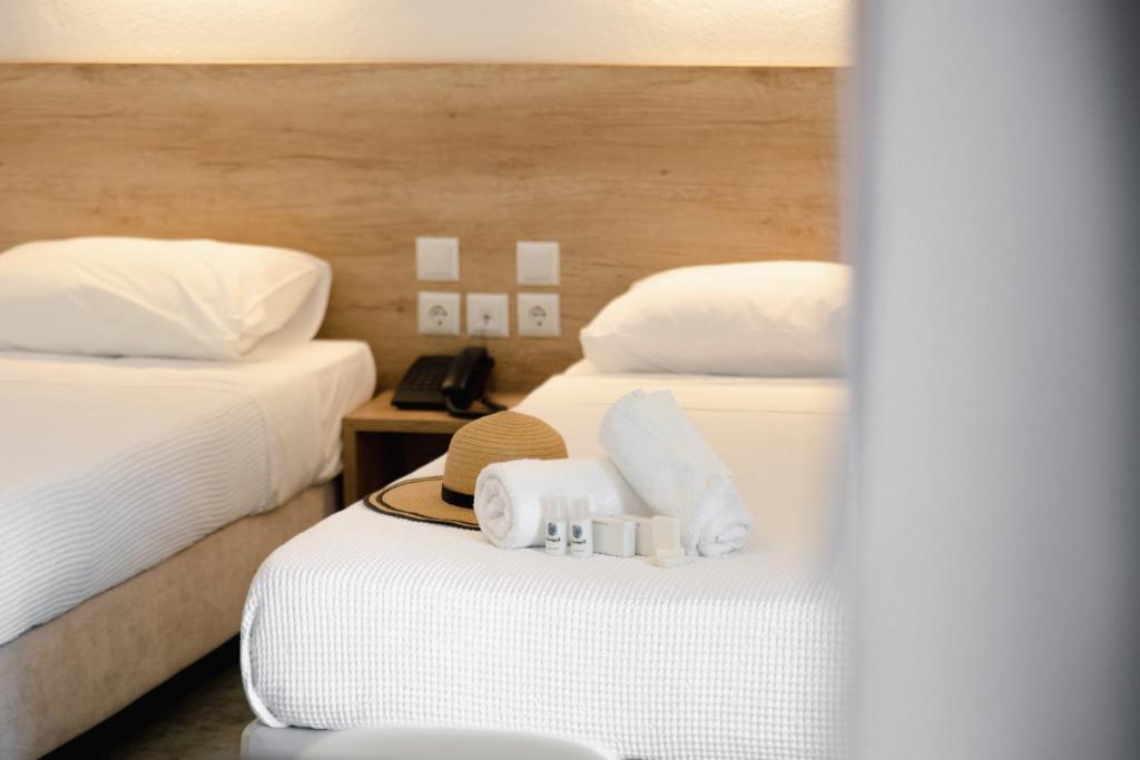 Voodi või voodid majutusasutuse Calma Beach Hotel toas