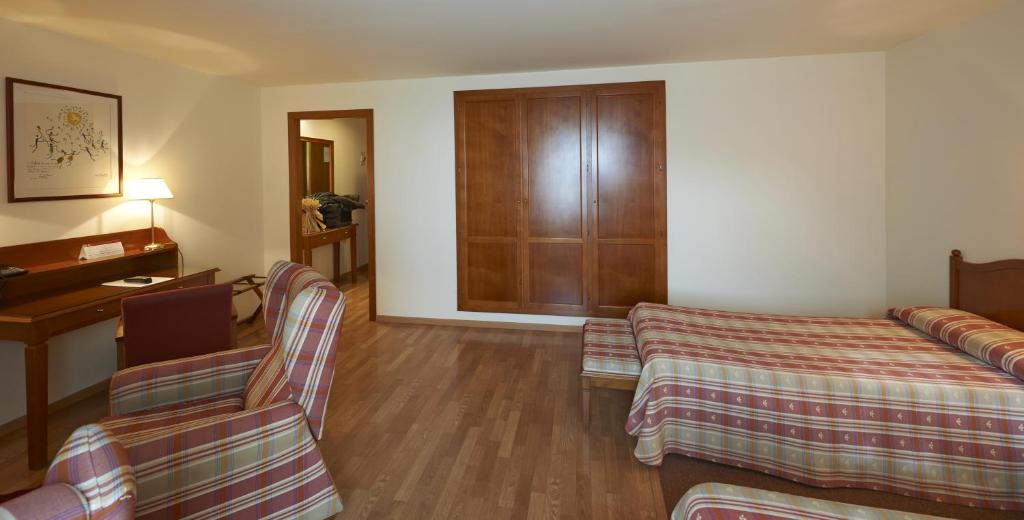 Cama o camas de una habitación en Hotel Abat Cisneros Montserrat