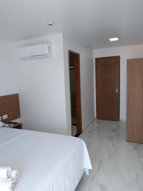 Pousada Sky Beach Flatにあるベッド