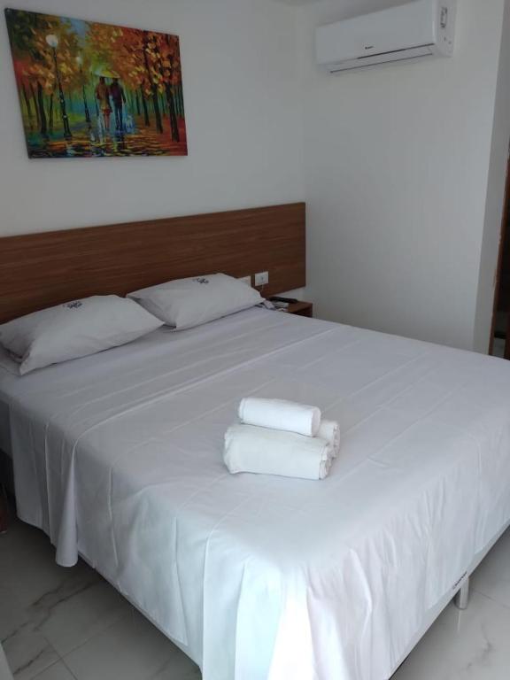 Pousada Sky Beach Flatにあるベッド
