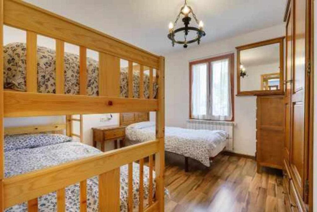 Postel nebo postele na pokoji v ubytování edificio CAPERAN 2hab o hab familiar WOWRURAL
