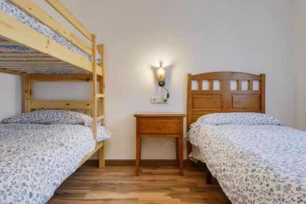Postel nebo postele na pokoji v ubytování edificio CAPERAN 2hab o hab familiar WOWRURAL