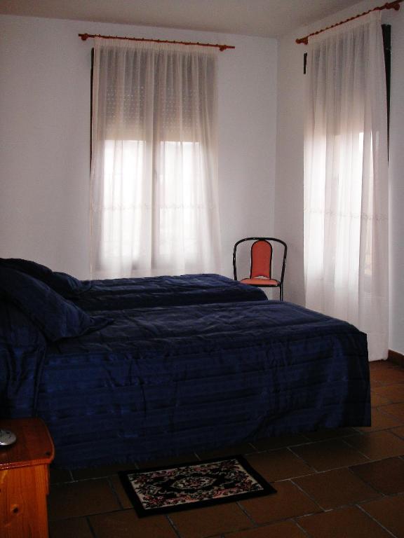 Posteľ alebo postele v izbe v ubytovaní Hotel Rural El Cuco