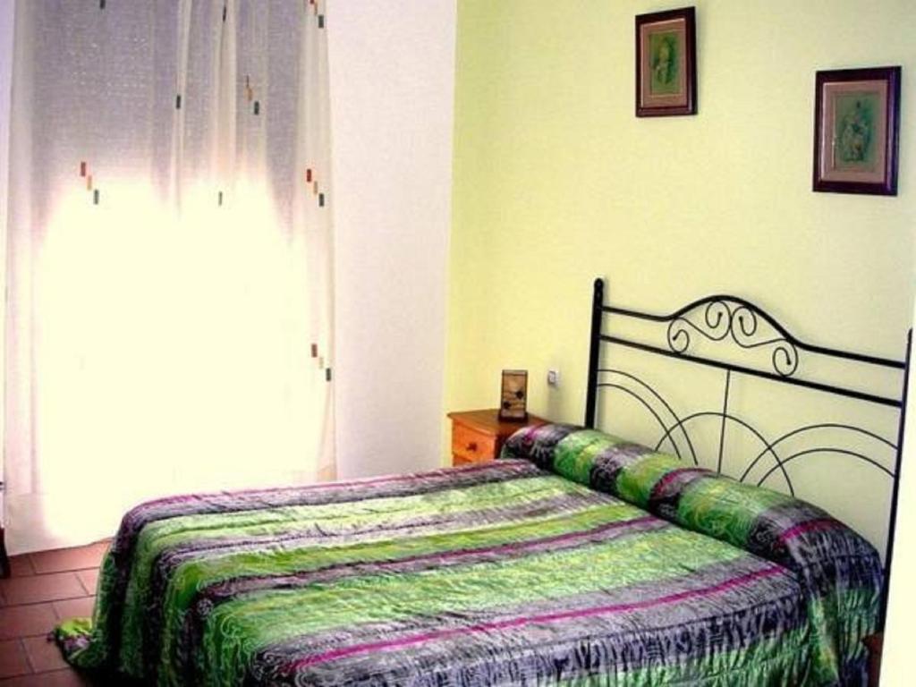 Posteľ alebo postele v izbe v ubytovaní Hotel Rural El Cuco