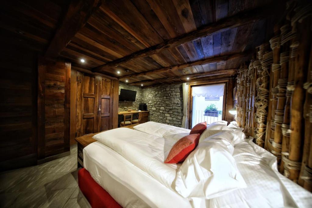 Letto o letti in una camera di Café Quinson Relais de Charme