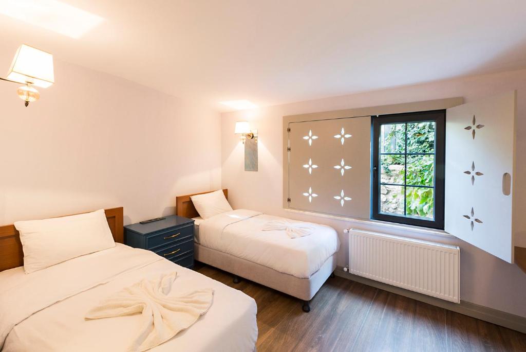 Postel nebo postele na pokoji v ubytování Sublime Porte Hotel