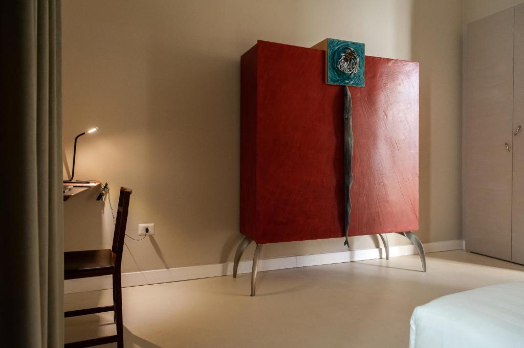 Łóżko lub łóżka w pokoju w obiekcie Atelier Inès Arts & Suites