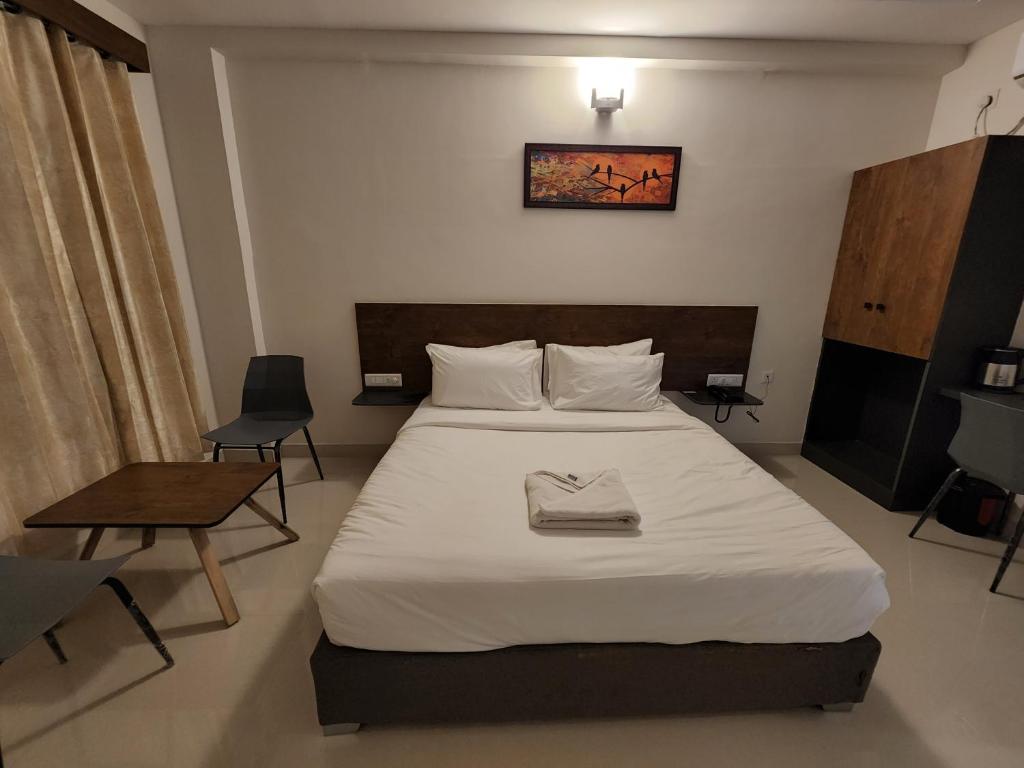 Postel nebo postele na pokoji v ubytování HOTEL PARK RAAMA